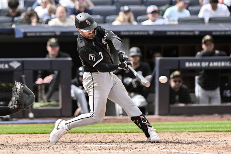 May 19, 2024; Bronx, New York, USA; Chicago White Sox third baseman Danny Mendick (0) hits a double against the New York Yankees during the seventh inning at Yankee Stadium. Mandatory Credit: John Jones-USA TODAY Sports