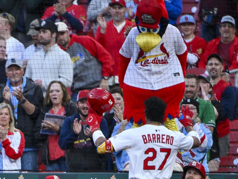 May 5, 2025; St. Louis, Missouri, USA;  St. Louis Cardinals shortstop Jose Barrero (27) is congratulated by manager Oliver Marmol (37) and left fielder Brendan Donovan (33) after hitting a solo home run against the Pittsburgh Pirates during the third inning at Busch Stadium. Mandatory Credit: Jeff Curry-Imagn Images