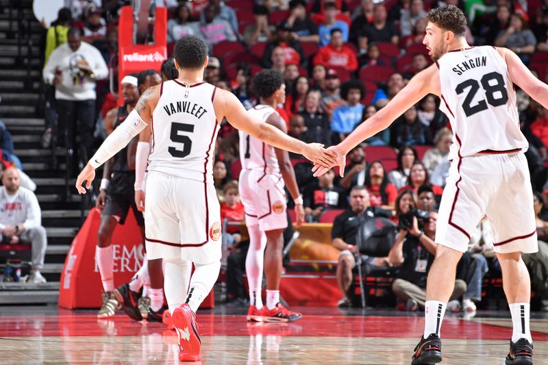 HOUSTON, TX -NOVEMBER 23: Fred VanVleet #5 and Alperen Sengun #28 of the Houston Rockets high five during the game against the Portland Trail Blazers on November 23, 2024 at the Toyota Center in Houston, Texas. NOTE TO USER: User expressly acknowledges and agrees that, by downloading and or using this photograph, User is consenting to the terms and conditions of the Getty Images License Agreement. Mandatory Copyright Notice: Copyright 2024 NBAE (Photo by Logan Riely/NBAE via Getty Images)