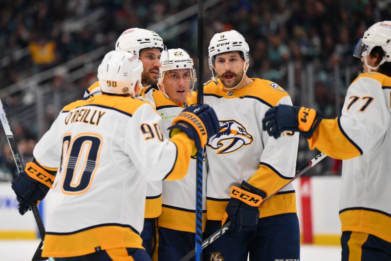 Nov 2, 2023; Seattle, Washington, USA; Nashville Predators defenseman Roman Josi (59) celebrates with teammates after scoring during the second period against the Seattle Kraken at Climate Pledge Arena. Mandatory Credit: Steven Bisig-USA TODAY Sports