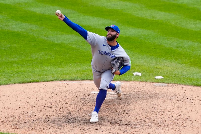 Aug 6, 2025; Denver, Colorado, USA; Toronto Blue Jays relief pitcher Tommy Nance (45) delivers a pitch in the ninth inning against the Colorado Rockies at Coors Field. Mandatory Credit: Ron Chenoy-Imagn Images