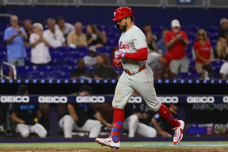 Sep 6, 2024; Miami, Florida, USA; Philadelphia Phillies designated hitter Kyle Schwarber (12) circles the bases after hitting a two-run home run against the Miami Marlins during the sixth inning at loanDepot Park. Mandatory Credit: Sam Navarro-Imagn Images