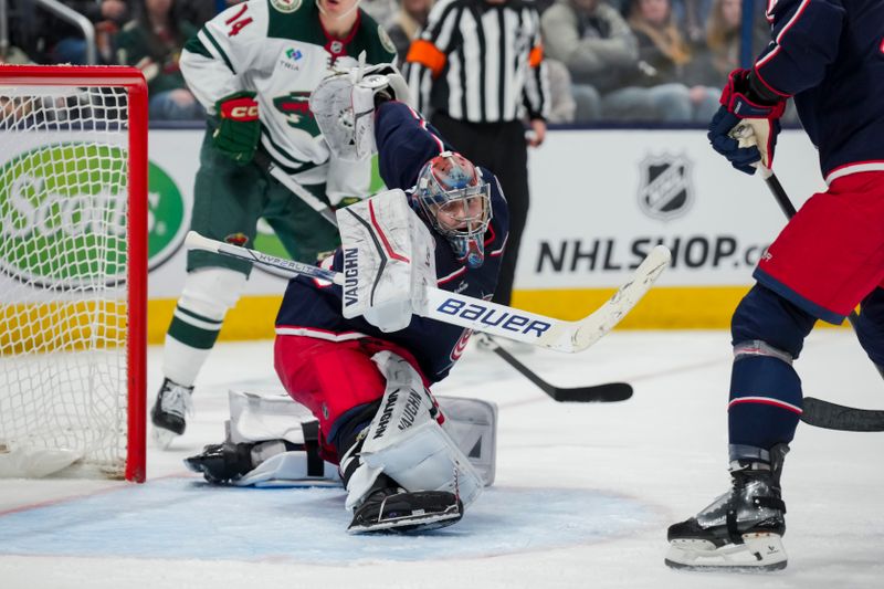 Jan 6, 2024; Columbus, Ohio, USA;  Columbus Blue Jackets goaltender Daniil Tarasov (40) stretches to attempt a save against the Minnesota Wild in the second period at Nationwide Arena. Mandatory Credit: Aaron Doster-USA TODAY Sports