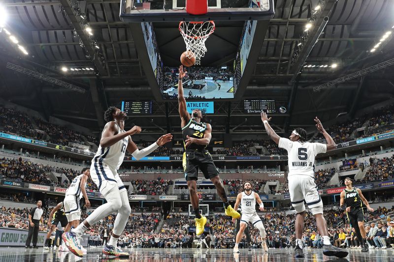 INDIANAPOLIS, IN - JANUARY 28: Aaron Nesmith #23 of the Indiana Pacers drives to the basket during the game against the Memphis Grizzlies on January 28, 2024 at Gainbridge Fieldhouse in Indianapolis, Indiana. NOTE TO USER: User expressly acknowledges and agrees that, by downloading and or using this Photograph, user is consenting to the terms and conditions of the Getty Images License Agreement. Mandatory Copyright Notice: Copyright 2024 NBAE (Photo by Jeff Haynes/NBAE via Getty Images)