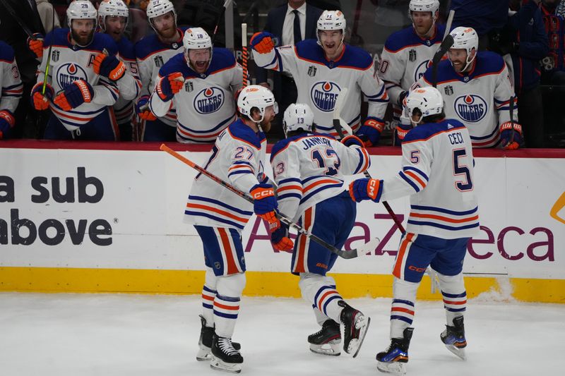 Jun 24, 2024; Sunrise, Florida, USA; Edmonton Oilers forward Mattias Janmark (13) celebrates scoring against Florida Panthers goaltender Sergei Bobrovsky (72) during the first period in game seven of the 2024 Stanley Cup Final at Amerant Bank Arena. Mandatory Credit: Jim Rassol-USA TODAY Sports