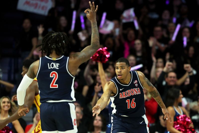 Jan 17, 2024; Tucson, Arizona, USA; Arizona Wildcats forward Keshad Johnson (16) celebrates a three point basket with guard Caleb Love (2) against the USC Trojans during the first half at McKale Center. Mandatory Credit: Zachary BonDurant-USA TODAY Sports