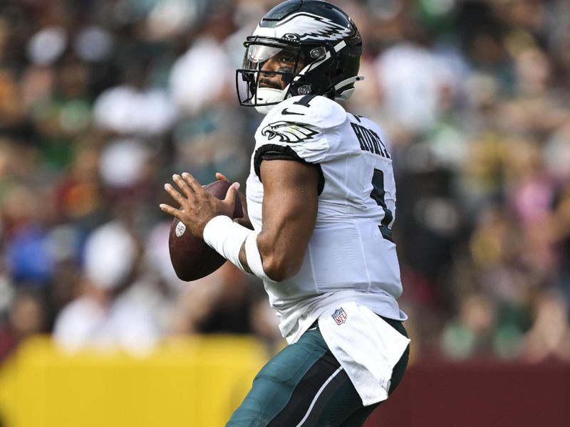 Philadelphia Eagles quarterback Jalen Hurts (1) looks to pass the ball during the first half of an NFL football game against the Washington Commanders, Sunday, Oct. 29, 2023, in Landover, Md. (AP Photo/Terrance Williams)