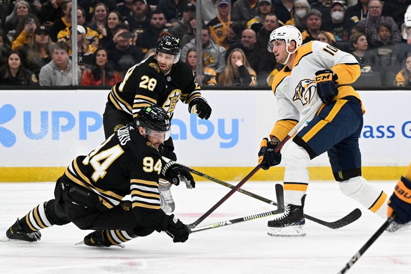 Oct 14, 2023; Boston, Massachusetts, USA; Nashville Predators center Colton Sissons (10) shoots the puck for a goal past Boston Bruins defenseman Derek Forbort (28) and center Jakub Lauko (94) during the first period at the TD Garden. Mandatory Credit: Brian Fluharty-USA TODAY Sports