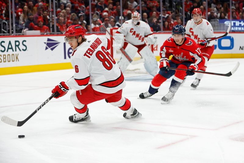 Jan 5, 2024; Washington, District of Columbia, USA; Carolina Hurricanes left wing Teuvo Teravainen (86) skates with the puck as Washington Capitals center Dylan Strome (17) chases in the first period at Capital One Arena. Mandatory Credit: Geoff Burke-USA TODAY Sports