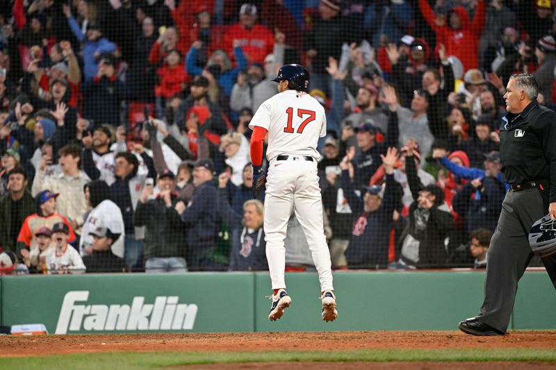 Apr 10, 2025; Boston, Massachusetts, USA; Boston Red Sox shortstop David Hamilton (17) scores the game winning run on an RBI by shortstop Trevor Story (10) during the tenth inning against the Toronto Blue Jays at Fenway Park. Mandatory Credit: Eric Canha-Imagn Images