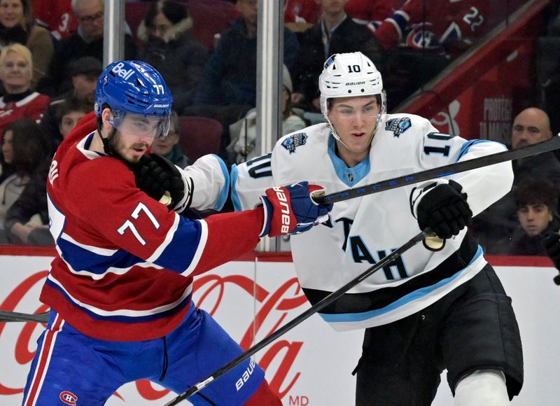 Nov 26, 2024; Montreal, Quebec, CAN; Utah Hockey Club defenseman Maveric Lamoureux (10) checks Montreal Canadiens forward Kirby Dach (77) during the first period at the Bell Centre. Mandatory Credit: Eric Bolte-Imagn Images