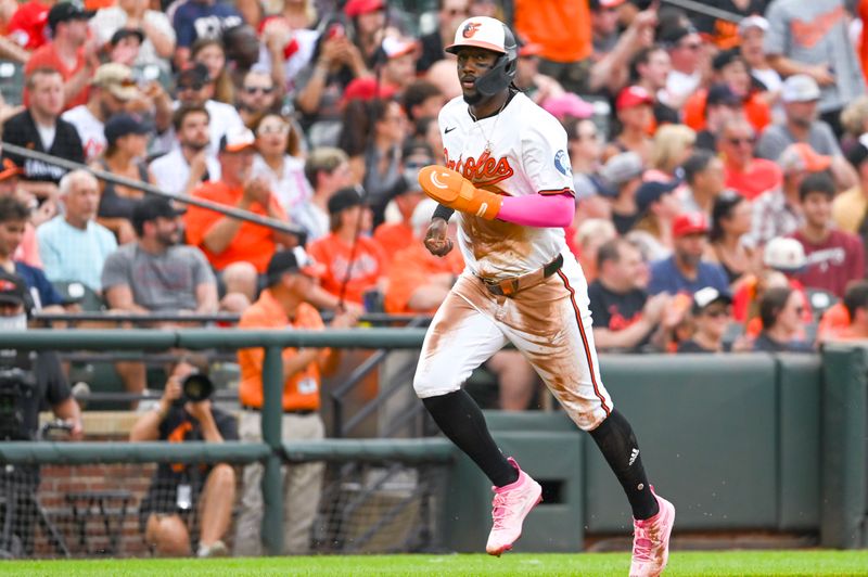 Jun 25, 2024; Baltimore, Maryland, USA;  Baltimore Orioles second baseman Jorge Mateo (3) scores during the second inning against the Cleveland Guardians at Oriole Park at Camden Yards. Mandatory Credit: Tommy Gilligan-USA TODAY Sports