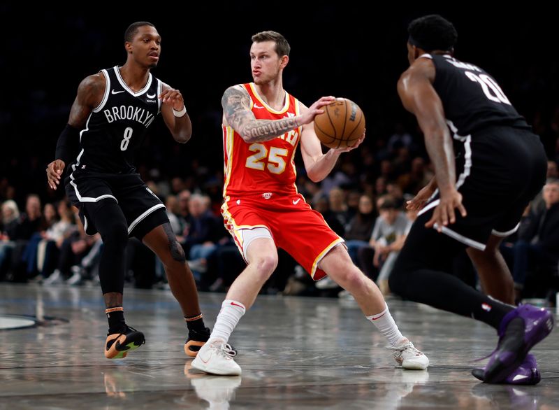 NEW YORK, NEW YORK - MARCH 02: Garrison Mathews #25 of the Atlanta Hawks dribbles as Lonnie Walker IV #8 and Day'Ron Sharpe #20 of the Brooklyn Nets defend during the second half at Barclays Center on March 02, 2024 in the Brooklyn borough of New York City. The Nets won 114-102. NOTE TO USER: User expressly acknowledges and agrees that, by downloading and or using this photograph, User is consenting to the terms and conditions of the Getty Images License Agreement. (Photo by Sarah Stier/Getty Images)