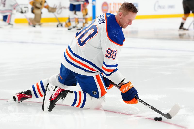 Feb 6, 2024; Las Vegas, Nevada, USA; Edmonton Oilers right wing Corey Perry (90) warms up before a game against the Vegas Golden Knights at T-Mobile Arena. Mandatory Credit: Stephen R. Sylvanie-USA TODAY Sports