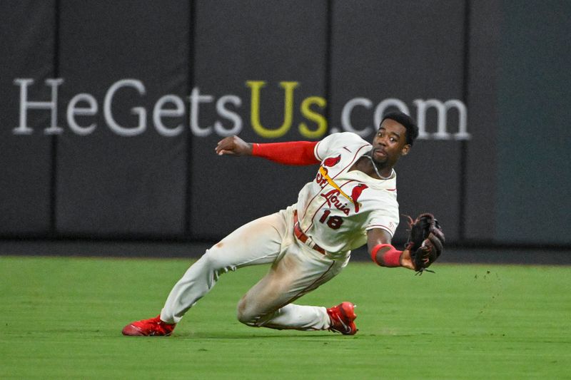 Sep 2, 2023; St. Louis, Missouri, USA;  St. Louis Cardinals right fielder Jordan Walker (18) slides and catches a line drive hit by Pittsburgh Pirates right fielder Connor Joe (not pictured) during the seventh inning at Busch Stadium. Mandatory Credit: Jeff Curry-USA TODAY Sports