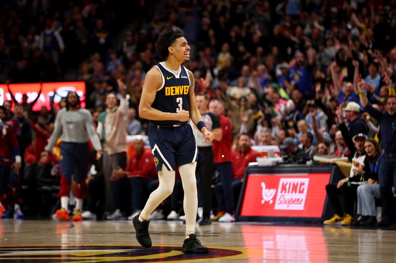 DENVER, COLORADO - NOVEMBER 6: Julian Strawther #3 of the Denver Nuggets celebrates a three pointer against the Oklahoma City Thunder at Ball Arena on November 6, 2024 in Denver, Colorado. NOTE TO USER: User expressly acknowledges and agrees that, by downloading and/or using this Photograph, user is consenting to the terms and conditions of the Getty Images License Agreement. (Photo by Jamie Schwaberow/Getty Images)