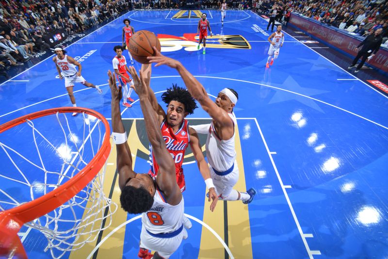 PHILADELPHIA, PA - NOVEMBER 12: Jared McCain #20 of the Philadelphia 76ers drives to the basket during the game against the New York Knicks during the Emirates NBA Cup game on November 12, 2024 at the Wells Fargo Center in Philadelphia, Pennsylvania NOTE TO USER: User expressly acknowledges and agrees that, by downloading and/or using this Photograph, user is consenting to the terms and conditions of the Getty Images License Agreement. Mandatory Copyright Notice: Copyright 2024 NBAE (Photo by Jesse D. Garrabrant/NBAE via Getty Images)