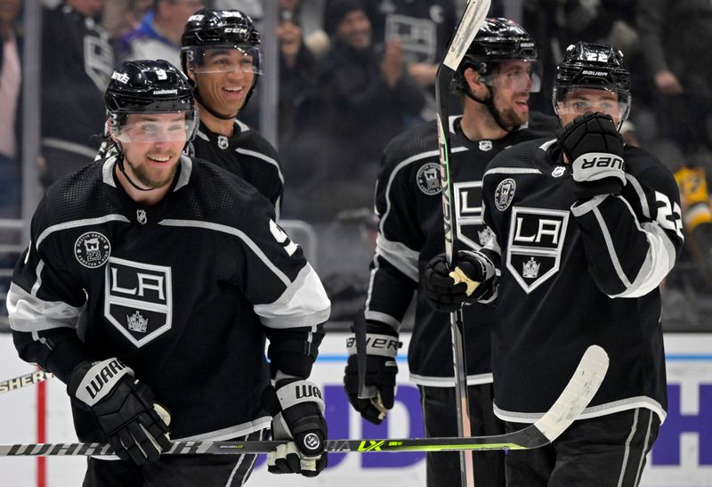 Feb 11, 2023; Los Angeles, California, USA;  Los Angeles Kings right wing Adrian Kempe (9), left,  smiles after scoring a hat trick with his third goal of the game in the second period against the Pittsburgh Penguins at Crypto.com Arena. Mandatory Credit: Jayne Kamin-Oncea-USA TODAY Sports