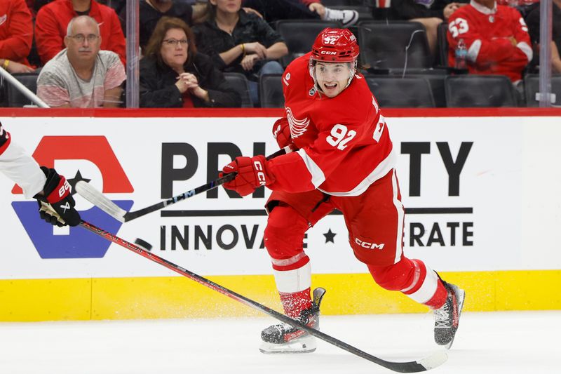 Oct 4, 2024; Detroit, Michigan, USA;  Detroit Red Wings center Marco Kasper (92) takes a shot in the second period against the Ottawa Senators at Little Caesars Arena. Mandatory Credit: Rick Osentoski-Imagn Images