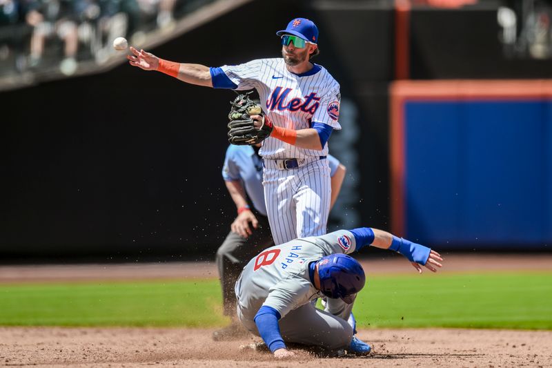 May 2, 2024; New York City, New York, USA; New York Mets second baseman Jeff McNeil (1) forces out Chicago Cubs outfielder Ian Happ (8) and throws to first to complete the double play against the Chicago Cubs during the third inning at Citi Field. Mandatory Credit: John Jones-USA TODAY Sports