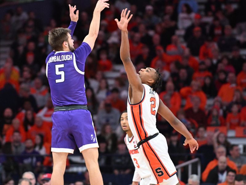 Dec 21, 2023; Syracuse, New York, USA; Niagara Purple Eagles guard Luke Bumbalough (5) takes a shot over Syracuse Orange guard JJ Starling (2) in the second half at the JMA Wireless Dome. Mandatory Credit: Mark Konezny-USA TODAY Sports