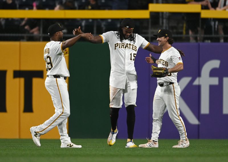 Jun 9, 2025; Pittsburgh, Pennsylvania, USA;  Pittsburgh Pirates outfielders Alexander Canario(29) and Oneil Cruz (15) and Adam Frazier (26) celebrate a 10-3 vixctory over the Miami Marlins at PNC Park. Mandatory Credit: Philip G. Pavely-Imagn Images