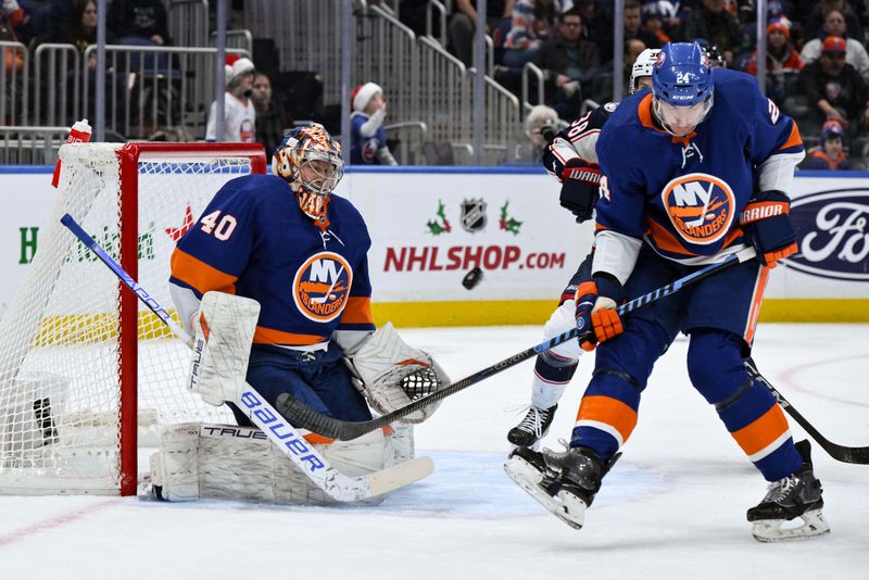 Dec 7, 2023; Elmont, New York, USA; New York Islanders goaltender Semyon Varlamov (40) makes a glove save against the Columbus Blue Jackets during the first period at UBS Arena. Mandatory Credit: John Jones-USA TODAY Sports