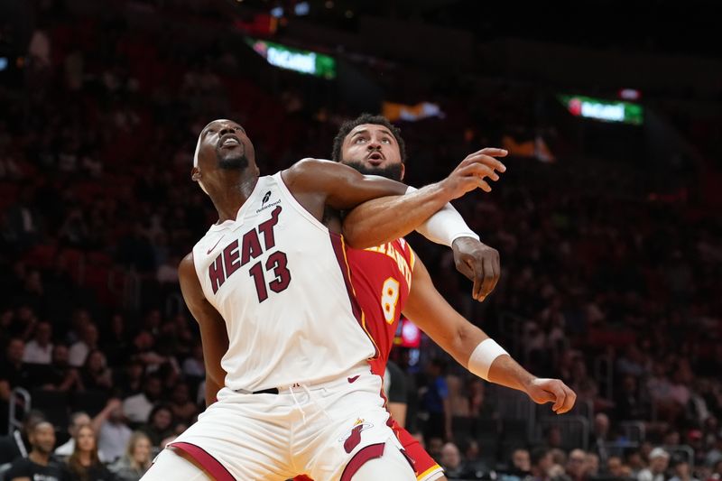 MIAMI, FL - OCTOBER 16: Bam Adebayo #13 of the Miami Heat boxes out during the game against the Atlanta Hawks during a preseason game on October 16, 2024 at Kaseya Center in Miami, Florida. NOTE TO USER: User expressly acknowledges and agrees that, by downloading and or using this Photograph, user is consenting to the terms and conditions of the Getty Images License Agreement. Mandatory Copyright Notice: Copyright 2024 NBAE (Photo by Eric Espada/NBAE via Getty Images)