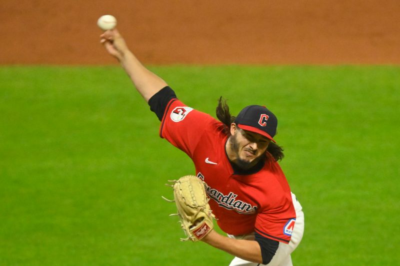 Sep 17, 2024; Cleveland, Ohio, USA; Cleveland Guardians relief pitcher Eli Morgan (49) delivers a pitch in the the sixth inning against the Minnesota Twins at Progressive Field. Mandatory Credit: David Richard-Imagn Images