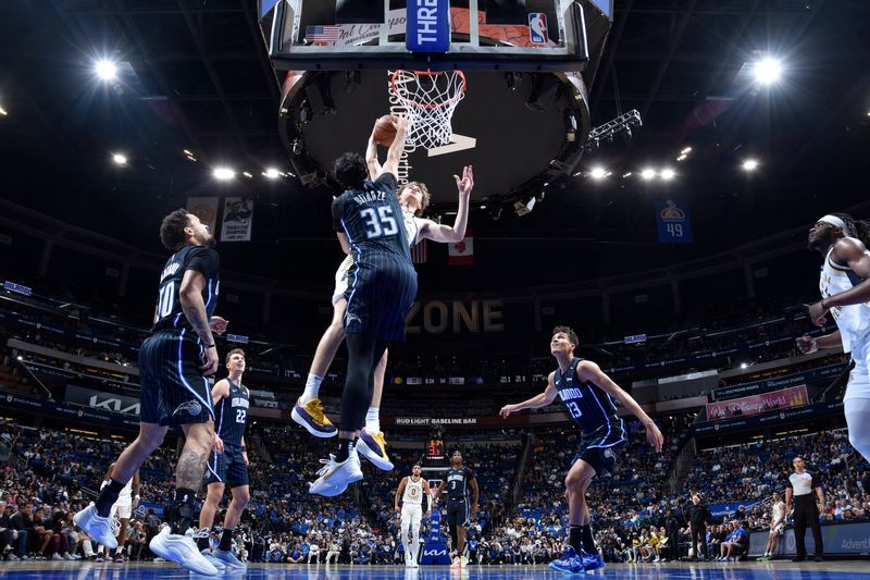 ORLANDO, FL - NOVEMBER 13: Goga Bitadze #35 of the Orlando Magic blocks the shot during the game against the Indiana Pacers on November 13, 2024 at Kia Center in Orlando, Florida. NOTE TO USER: User expressly acknowledges and agrees that, by downloading and or using this photograph, User is consenting to the terms and conditions of the Getty Images License Agreement. Mandatory Copyright Notice: Copyright 2024 NBAE (Photo by Fernando Medina/NBAE via Getty Images)
