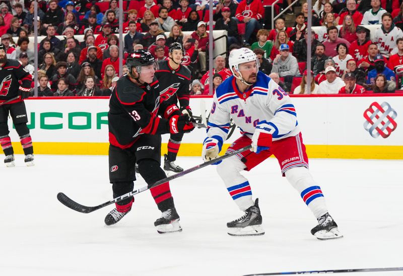 Nov 27, 2024; Raleigh, North Carolina, USA;  Carolina Hurricanes right wing Jackson Blake (53) scores a goal against the New York Rangers during the third period at Lenovo Center. Mandatory Credit: James Guillory-Imagn Images