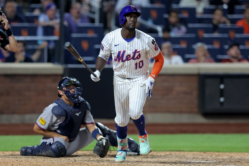 Jun 24, 2025; New York City, New York, USA; New York Mets second baseman Ronny Mauricio (10) follows through on an RBI double against the Atlanta Braves during the ninth inning at Citi Field. Mandatory Credit: Brad Penner-Imagn Images