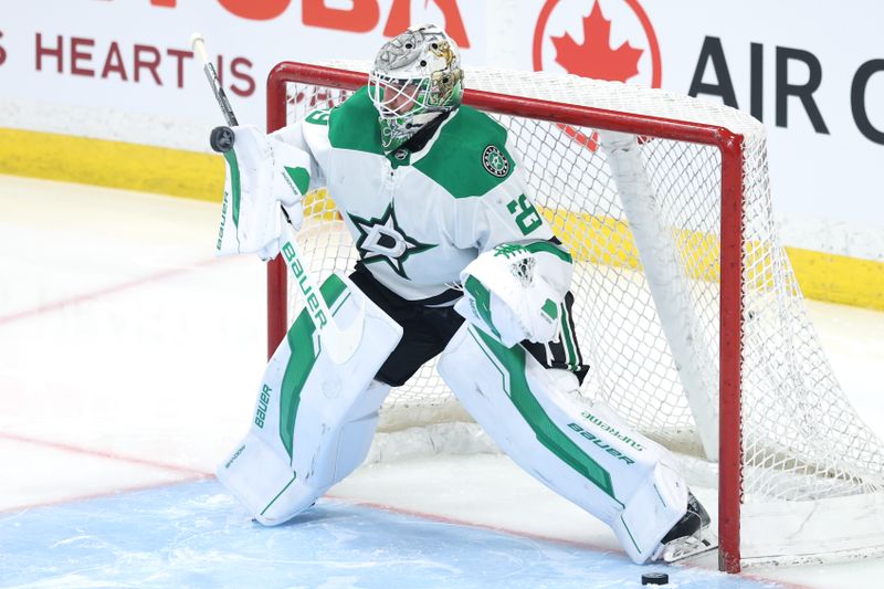 May 9, 2025; Winnipeg, Manitoba, CAN; Dallas Stars goaltender Jake Oettinger (29) warms up before a game against the Winnipeg Jets in game two of the second round of the 2025 Stanley Cup Playoffs at Canada Life Centre. Mandatory Credit: James Carey Lauder-Imagn Images