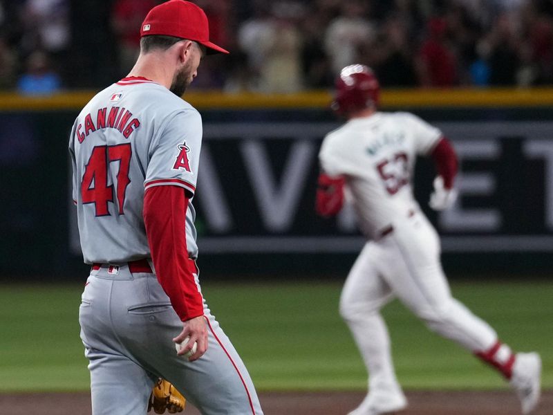 Jun 13, 2024; Phoenix, Arizona, USA; Los Angeles Angels pitcher Griffin Canning (47) reacts after a three run home run by Arizona Diamondbacks first base Christian Walker (53) during the first inning at Chase Field. Mandatory Credit: Joe Camporeale-USA TODAY Sports