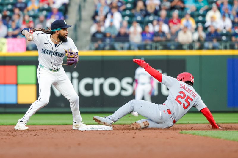 Sep 9, 2025; Seattle, Washington, USA; Seattle Mariners shortstop J.P. Crawford (3) holds back from attempting a double play after getting a force out against St. Louis Cardinals second baseman Thomas Saggese (25) during the second inning at T-Mobile Park. Mandatory Credit: Joe Nicholson-Imagn Images