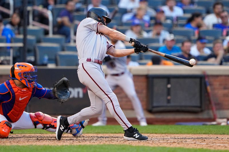 Sep 14, 2023; New York City, New York, USA; Arizona Diamondbacks center fielder Jake McCarthy (31) hits an RBI double against the New York Mets during the eighth inning at Citi Field. Mandatory Credit: Gregory Fisher-USA TODAY Sports