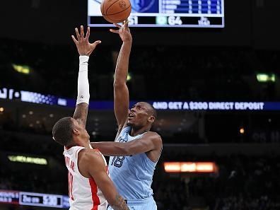 MEMPHIS, TENNESSEE - DECEMBER 15: Bismack Biyombo #18 of the Memphis Grizzlies shoots against Jabari Smith Jr. #10 of the Houston Rockets during the first half at FedExForum on December 15, 2023 in Memphis, Tennessee. NOTE TO USER: User expressly acknowledges and agrees that, by downloading and or using this photograph, User is consenting to the terms and conditions of the Getty Images License Agreement. (Photo by Justin Ford/Getty Images)