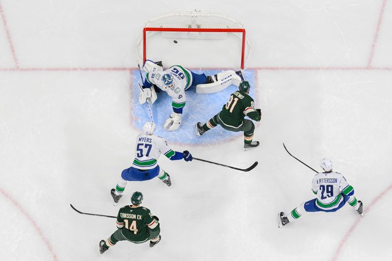 Nov 1, 2025; Saint Paul, Minnesota, USA;  Minnesota Wild forward Vladimir Tarasenko (91) scores a power play goal on Vancouver Canucks goalie Thatcher Demko (35) as defensemen Tyler Myers (57) and defensemen Marcus Pettersson (29) defend during the first period at Grand Casino Arena. Mandatory Credit: Nick Wosika-Imagn Images