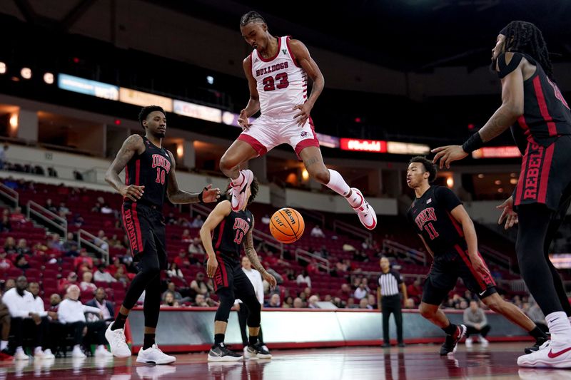 Feb 14, 2024; Fresno, California, USA; Fresno State Bulldogs guard Leo Colimerio (23) has the ball knocked out of his hands by UNLV Rebels guard Dedan Thomas Jr. (11) in the second half at the Save Mart Center. Mandatory Credit: Cary Edmondson-USA TODAY Sports