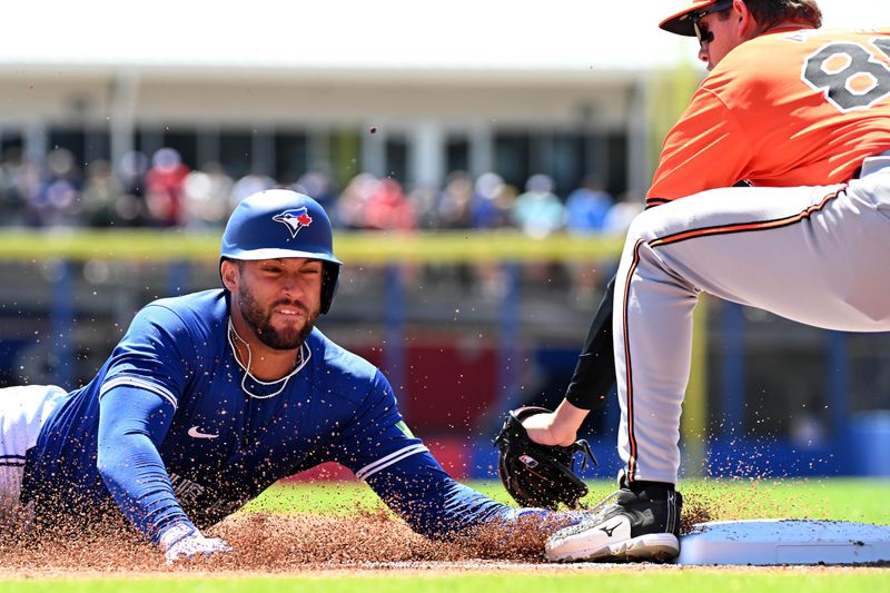 Mar 19, 2024; Dunedin, Florida, USA; Toronto Blue Jays right fielder George Springer (4) gets tagged out by Baltimore Orioles third baseman Coby Mayo (86) in the first inning of the spring training game at TD Ballpark. Mandatory Credit: Jonathan Dyer-USA TODAY Sports