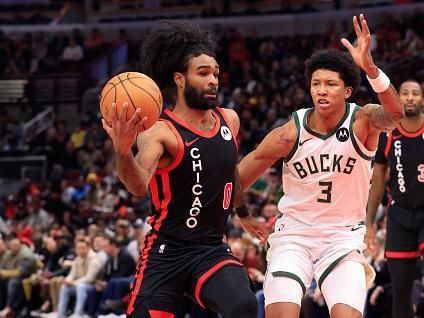 CHICAGO, ILLINOIS - NOVEMBER 30: Coby White #0 of the Chicago Bulls drives to the basket in the game against the Milwaukee Bucks at the United Center on November 30, 2023 in Chicago, Illinois. NOTE TO USER: User expressly acknowledges and agrees that, by downloading and or using this photograph, User is consenting to the terms and conditions of the Getty Images License Agreement. (Photo by Justin Casterline/Getty Images)