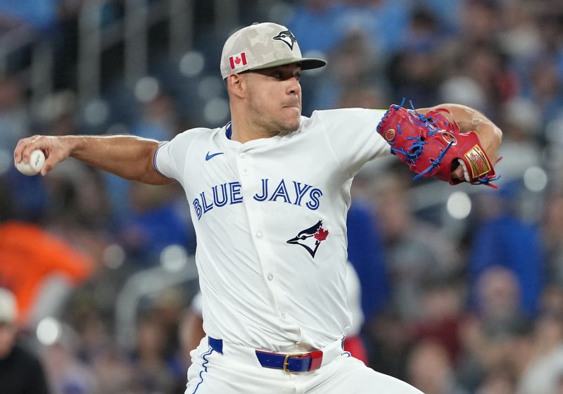 May 18, 2025; Toronto, Ontario, CAN; Toronto Blue Jays starting pitcher Jose Berríos (17) throws a pitch against the Detroit Tigers during the first inning at Rogers Centre. Mandatory Credit: Nick Turchiaro-Imagn Images