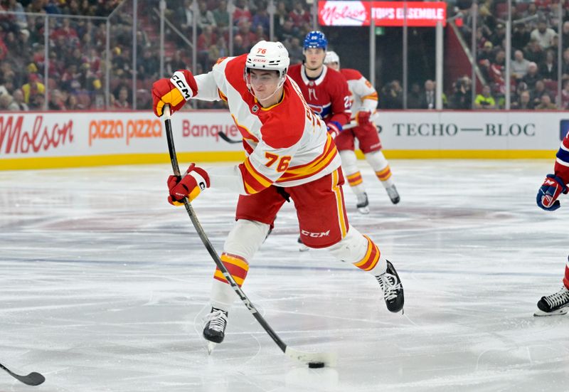 Nov 5, 2024; Montreal, Quebec, CAN; Calgary Flames forward Martin Pospisil (76) shoots the puck during the third period of the game against the Montreal Canadiens at the Bell Centre. Mandatory Credit: Eric Bolte-Imagn Images