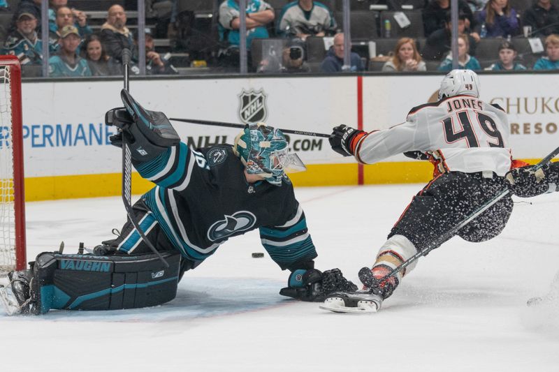 Feb 29, 2024; San Jose, California, USA; San Jose Sharks goaltender Kaapo Kahkonen (36) defends against Anaheim Ducks left wing Max Jones (49) during the third period at SAP Center at San Jose. Mandatory Credit: Stan Szeto-USA TODAY Sports