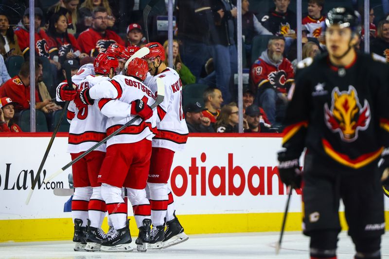 Oct 24, 2024; Calgary, Alberta, CAN; Carolina Hurricanes center Martin Necas (88) celebrates his goal with teammates against the Calgary Flames during the second period at Scotiabank Saddledome. Mandatory Credit: Sergei Belski-Imagn Images