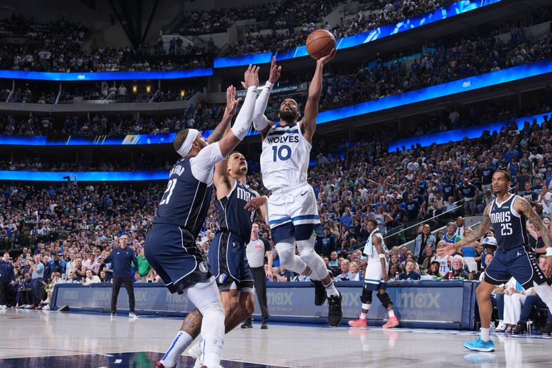DALLAS, TX - MAY 26: Mike Conley #10 of the Minnesota Timberwolves drives to the basket during the game against the Dallas Mavericks during Game 3 of the Western Conference Finals of the 2024 NBA Playoffs on May 26, 2024 at the American Airlines Center in Dallas, Texas. NOTE TO USER: User expressly acknowledges and agrees that, by downloading and or using this photograph, User is consenting to the terms and conditions of the Getty Images License Agreement. Mandatory Copyright Notice: Copyright 2024 NBAE (Photo by Jesse D. Garrabrant/NBAE via Getty Images)