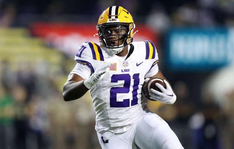 Oct 21, 2023; Baton Rouge, Louisiana, USA; LSU Tigers running back Noah Cain (21) carries the ball against the Army Black Knights during the second half at Tiger Stadium. Mandatory Credit: Danny Wild-USA TODAY Sports