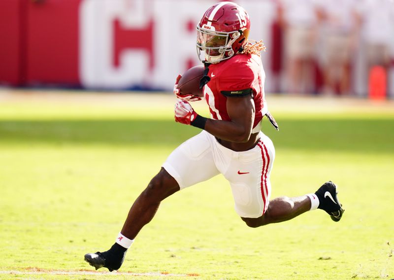 Oct 21, 2023; Tuscaloosa, Alabama, USA; Alabama Crimson Tide wide receiver Kendrick Law (19) carries up the field against the Tennessee Volunteers during the first half at Bryant-Denny Stadium. Mandatory Credit: John David Mercer-USA TODAY Sports