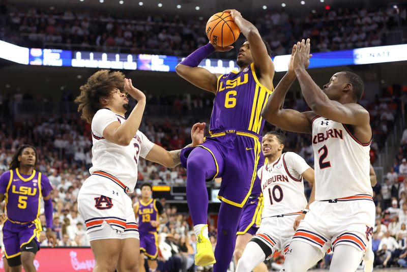 Jan 13, 2024; Auburn, Alabama, USA; LSU Tigers guard Jordan Wright (6) takes a shot between Auburn Tigers guard Tre Donaldson (3) and forward Jaylin Williams (2) during the first half at Neville Arena. Mandatory Credit: John Reed-USA TODAY Sports