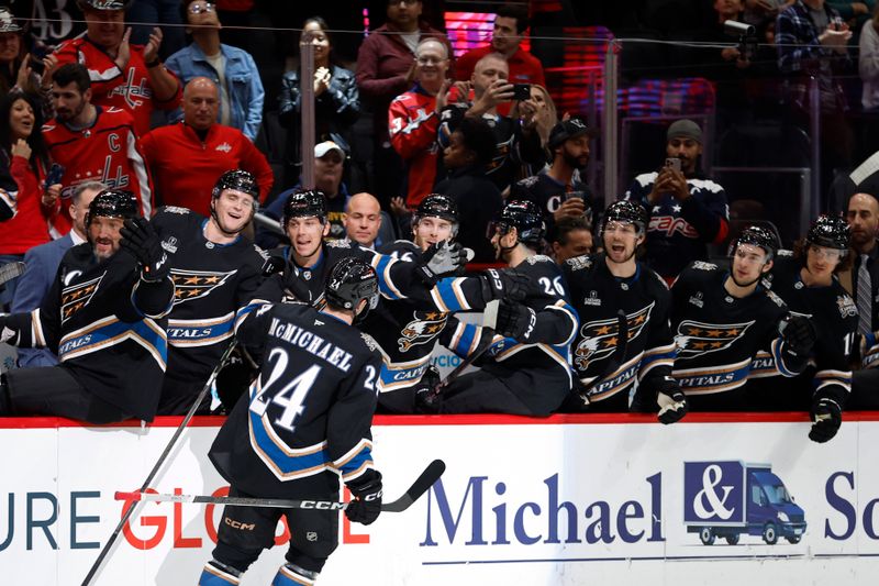 Nov 6, 2024; Washington, District of Columbia, USA; Washington Capitals center Connor McMichael (24) celebrates with teammates after scoring a goal against the Nashville Predators in the first period at Capital One Arena. Mandatory Credit: Geoff Burke-Imagn Images